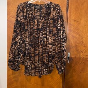 Women’s blouse .  Brown and black top with full dolman type sleeves .